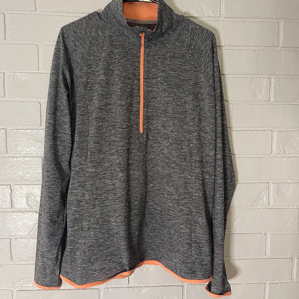 Long sleeved, dry fit. Half zipper.